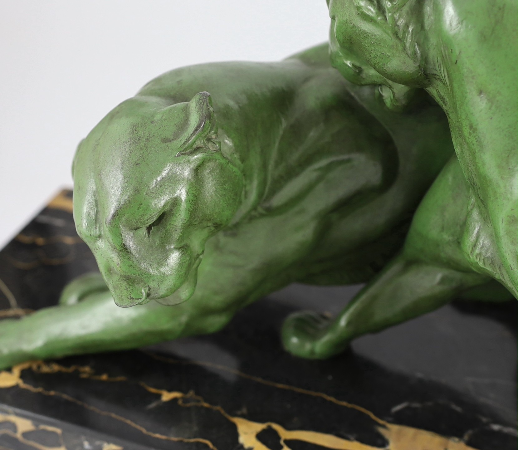 Plagnet. A French Art Deco patinated spelter group of two panthers, 79cm long, 25cm deep, 32cm high